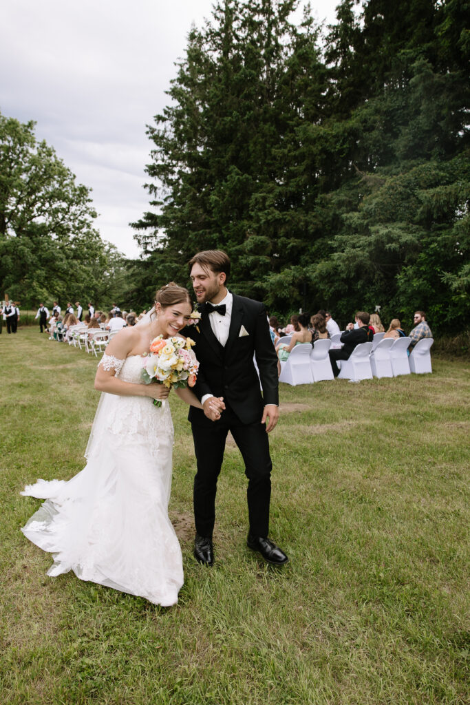 Bride and groom walking down aisle.